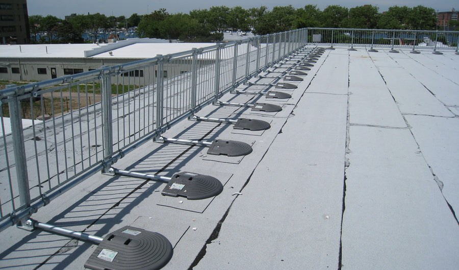 The image shows guardrail systems in place at a rooftop.