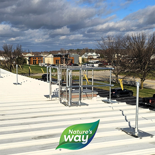 Rooftop safety fall protection featuring Safety Rail Source NextGen Continuous Railing and Warning Lines at Nature's Way facility in Green Bay, WI.