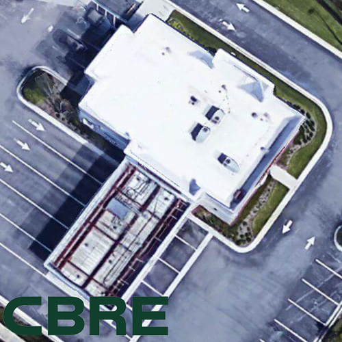 Ariel view of a commercial roof and parking lot