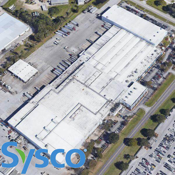 Aerial satellite view of the Sysco Foods facility roof in Ocoee, FL, site of NextGen 3000 guardrail and ladder safety installation.