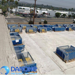 Rooftop view of a commercial building with a logo over of Danone.