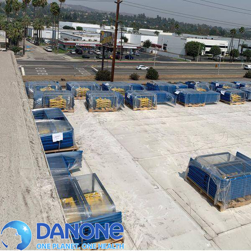Rooftop view of a commercial building with a logo over of Danone.