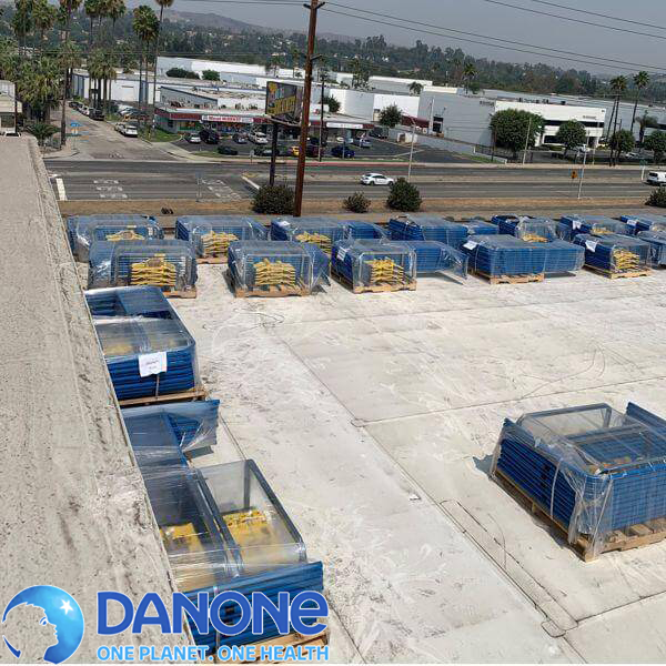 Rooftop view of a commercial building with a logo over of Danone.