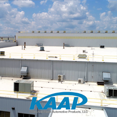 Ariel view of a white rooftop with yellow railing
