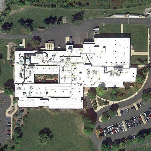 Aerial satellite view of a Bellefonte, PA manufacturing plant roof prior to Safety Rail Source guardrail installation.