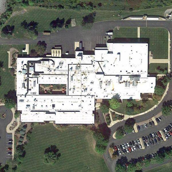 Aerial satellite view of a Bellefonte, PA manufacturing plant roof prior to Safety Rail Source guardrail installation.