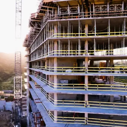 A construction site that uses multiple tensioned webrails installed for fall protection