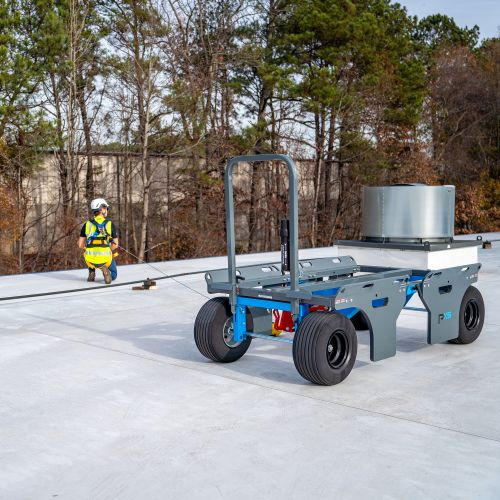 Construction worker using a mobile fall protection system on a job site