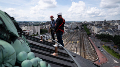 Workers on a roof using the Securail custom fall arrest system