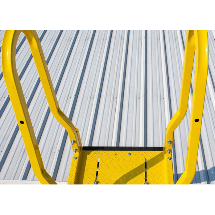 Yellow metal ladder against a corrugated metal wall