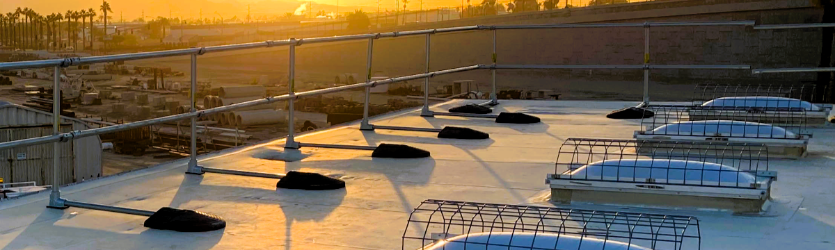 Roof top with skylights and Kee Guard Railing at sunset