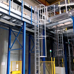 NextGen Mighty-Lite Fixed Ladder - Storage rack system in a warehouse setting with blue support beams and white shelves.