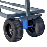 Close-up of a blue hand truck with large wheels on a white background