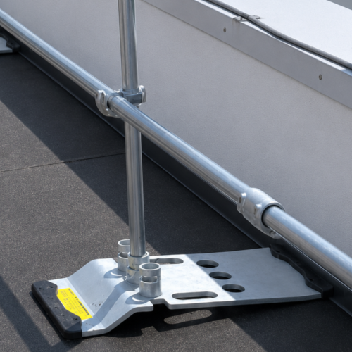 Metal roof access ladder on a flat roof