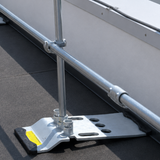 Metal roof access ladder on a flat roof